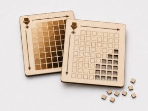 Imagen de una cuadrícula de pruebas láser con diferentes niveles de potencia y velocidad para comparar resultados de corte y grabado sobre madera.